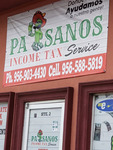 Photograph of Paisanos Income Tax Service Sign by Sara E. Azua and Sam Gonzalez