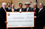 [PUF Check] Photograph of Chancellor Francisco Cigarroa, MD,  presenting 1st PUF check - 08