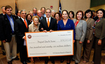 [PUF Check] Photograph of Chancellor Francisco Cigarroa, MD,  presenting 1st PUF check - 10