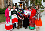 [Charro Days] Photograph of Dr. Juliet Garcia With Ozzie the Ocelot and Students by University of Texas at Brownsville and Paul Chouy