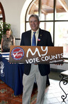 [Partnership] Photograph of Partnership Event Guest Holding Sign by University of Texas at Brownsville and Paul Chouy